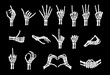 © Vector Tradition - Skeleton hand gestures. Vector Halloween human skull finger bones showing peace, rock, ok, heart and love signs. Index finger pointing up, shaka, thumb up, fist, handshake and high five hand gestures