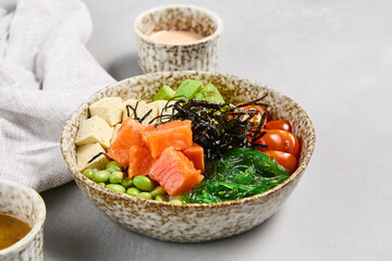 Canvas Print - Fresh Salmon Poke Bowl with Avocado, Tomatoes, and Tofu