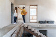 © Hernandez & Sorokina/Stocksy - Couple Examining Progress At Their House Construction