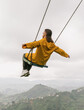 © Anna Sorokina/Stocksy - Woman on Swing Above Karadeniz Tea Plantation