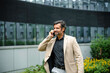 © DZ FILM/Stocksy - A man is talking on a mobile phone in the city