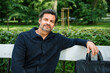 © DZ FILM/Stocksy - A businessman in a city park