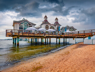 Wall Mural - Dramatic summer view of popular historical landmark - Sellin pier. Beautiful morning cityscape of Sellin resort town on the German island of Rugen, Germany, Europe. Stunning seascape of Baltic Sea.