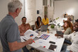 © VICTOR TORRES/Stocksy - Team collaborating and brainstorming during an office meeting