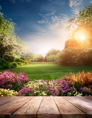 Summer flowers garden background with empty table in front.