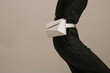 © Ulas&Merve/Stocksy - Elegant Woman Wearing Stylish White Belt Bag
