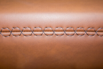 Close up shot of automotive leather wrap with stitch for background use.