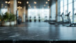 © Mahmud - 'Empty black marble stone table top set against a blurred background with bokeh effects of an exercise room, fitness center, or gym interior. Ideal for showcasing or presenting your products.'
