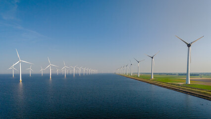 Wall Mural - Majestic Windmill Park Overlooking Tranquil Waters in the Netherlands