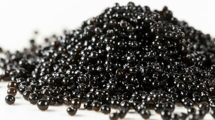 Balls of black pearls in a pile on the table, often used for jewelry.