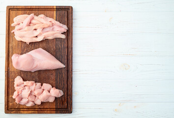 Wall Mural - Raw chicken meat fillet ( breast ) Various of cutting in form slice and cube