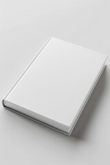 Poster - A white book sitting on a white surface, perfect for use in minimalist design projects