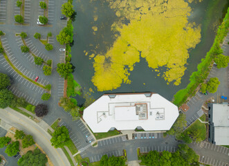 A parking lot with a building in the background