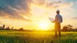 © Ndoomyim - Engineer Surveying Land at Sunset