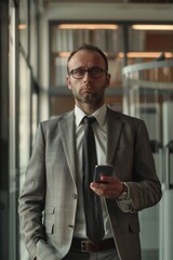 Aufkleber - Professional in formal attire using mobile device