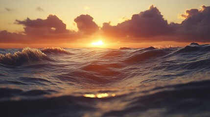 Wall Mural - Sunset cloudscape over the waves in the water on a summer evening.