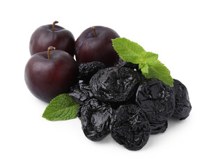 Wall Mural - Delicious prunes, fresh ripe plums and mint isolated on white