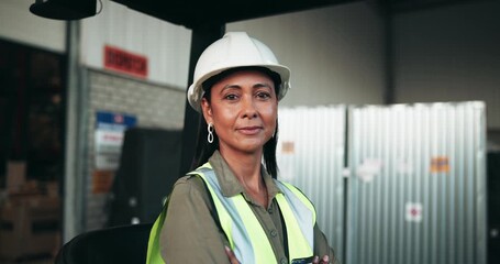 Canvas Print - Woman, face and forklift driver for logistics with arms crossed, timelapse and safety helmet at warehouse. Person, truck and vehicle for supply chain with transport at industrial factory in Colombia