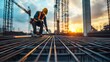 © Oulaphone - Close up construction worker working on steel rebar frames at the site of an industrial building under creation metal girder frame structure of a concrete modern commercial complex.
