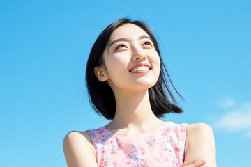 Wall Mural - Chinese woman smile enjoying sun during summer vacation, mental health