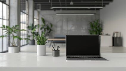 Aufkleber - A laptop on a white table in a modern office setting