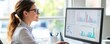 © DigitalMagicVisions - Confident Female Business Analyst Using Computer for Financial Analysis in Office Setting