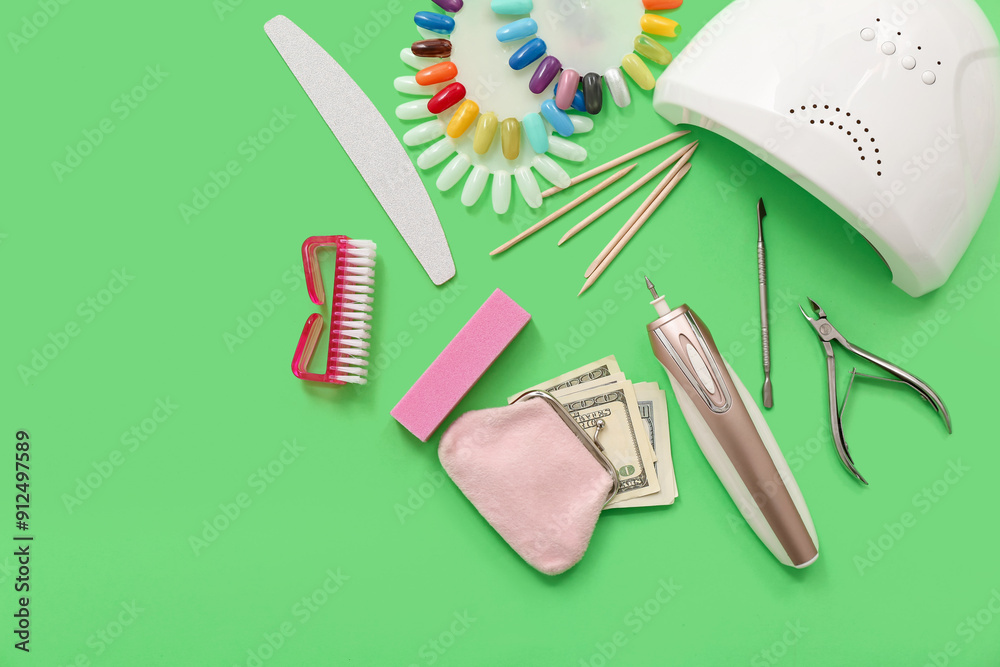 Composition with supplies for manicure, wallet and money on green background