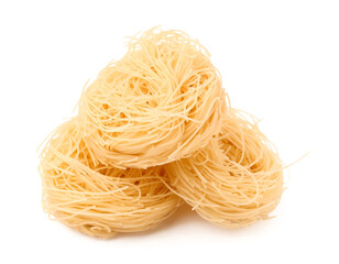 Wall Mural - Tasty raw pasta nests on white background