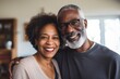 © Baba Images - Portrait of a senior African American couple at home