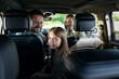 © New Africa - Happy family enjoying trip together by car, view from inside