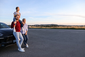 Sticker - Happy parents and their daughter near car outdoors, space for text