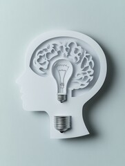 Poster - Lightbulb Brain: The Power of Ideas - A paper cut-out of a human head with a lightbulb representing an idea illuminating the brain. This image symbolizes creativity, innovation, inspiration, knowledge