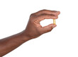 © photka - Man holding a pill in his fingers, isolated on white or transparent background