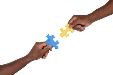 Man trying to match pieces of jigsaw puzzle, isolated on white background