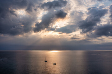 Wall Mural - Drone flying over sea in a beautiful sunset in Indian Ocean, Mauritius. Aerial drone shoot. Sunrise over the sea. Colorful sunset on the Indian Ocean, Mauritius.