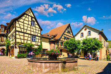 Wall Mural - Riquewihr, France - July 2, 2022: Riquewihr village on Alsatian Wine Route, France. Most beautiful villages of France, Riquewihr in Alsace, famous 