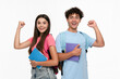© InsideCreativeHouse - Happy overenjoyed winners high school pupils students teenagers classmates boy girl in casual with bag holding copybooks celebrating having success winning gesture isolated on white background.