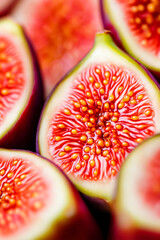 Wall Mural - Macro shot of the texture of a ripe figs inside displaying vibrant red and yellow seeds with intricate patterns 