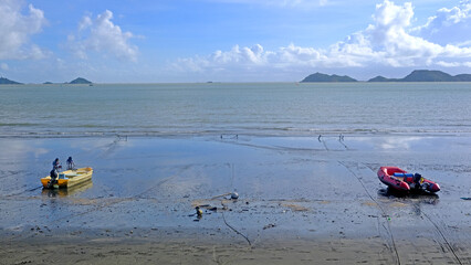 Natural landscape background, fishing boats, beach,  white clouds, ocean, coastline and some islands