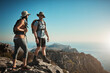 © peopleimages.com - Hiking, journey and couple on mountain with backpack for adventure, cliff trekking and fitness. Travel, nature trail and people for wellness and exercise achievement on holiday, mockup or vacation