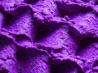 Wall Mural - Frozen Lavender flavour gelato - full frame detail of sorbet. Close up of a violet surface texture of Ice cream filled with pieces of mixed flowers.