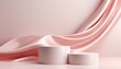 © Png - Video - Photo - Two cylindrical white podiums with a flowing pink silk fabric drape, ideal for product presentation or mock-up