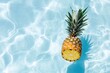 © volga - Tropical pineapple floating in pool summer sun