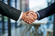 © ReeseArcurs/peopleimages.com - Business people, investor or handshake in zoom for meeting, partnership or greeting at law firm. Closeup, welcome or corporate lawyer with client for deal negotiation, support and legal consulting