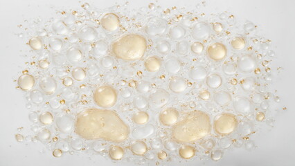 Poster - Oil and water droplets on a white background. The droplets are various sizes and shapes, creating a dynamic and interesting pattern