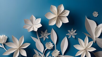 White paper cut flowers with copy space surface on a blue background for winter. Paper craft wedding décor made of origami