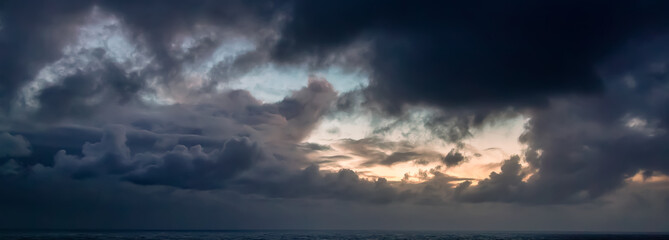 Wall Mural - Dramatic Colorful Sunrise Sky over North Atlantic Ocean.