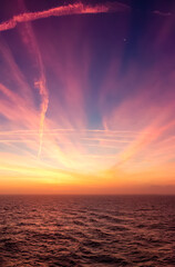 Wall Mural - Dramatic Colorful Sunrise Sky over North Atlantic Ocean.