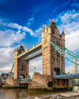 © edb3_16 - Historic Bridge over River Thames and Cityscape Skyline during dramatic sunrise. Tower Bridge in City of London, United Kingdom. Travel Destination.