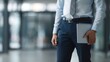 © KKC Studio - Confident Businessman with Folder in Modern Urban Office Setting